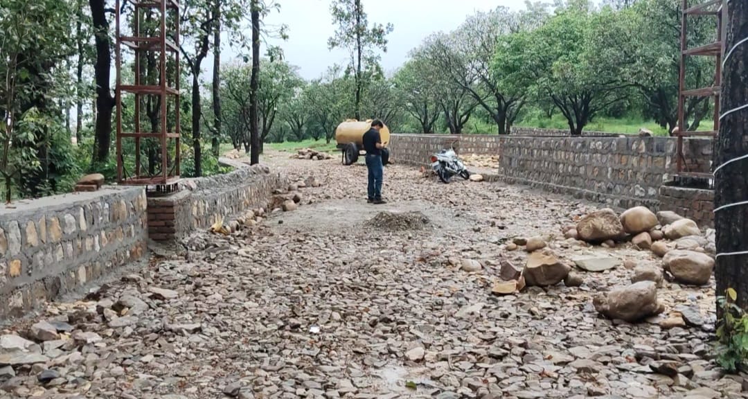 Entrance road with gate pillars and stone walls